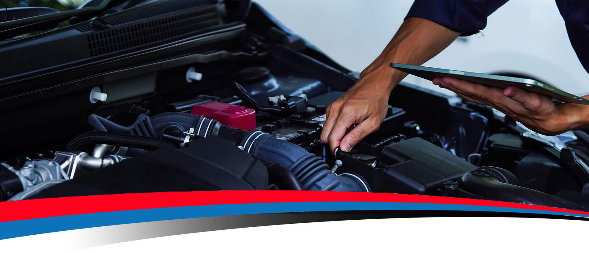 Mechanic working on a car engine